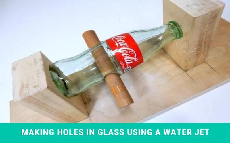 Making holes in glass using a water jet